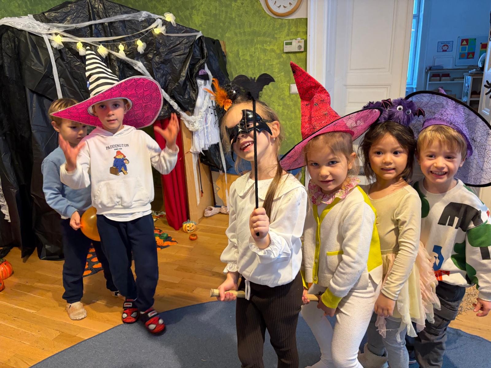 Children playing together with colourful hats and costumes